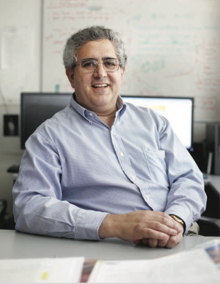 Weinberg sitting at desk